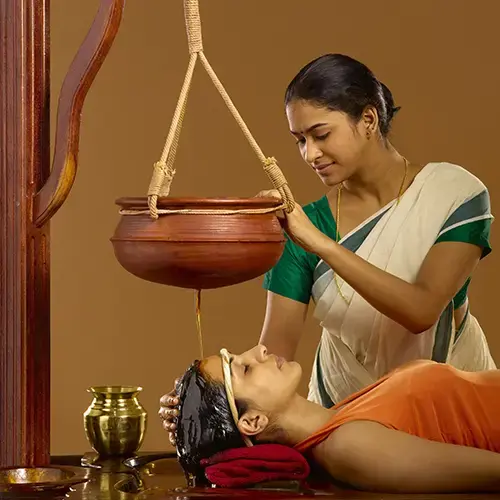 Shirodhara Ayurvedic therapy at Sandhya Medicity